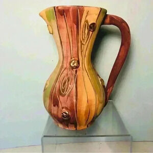 Made in Italy. Hand painted gold  accents clay pitcher. Perfected condition.